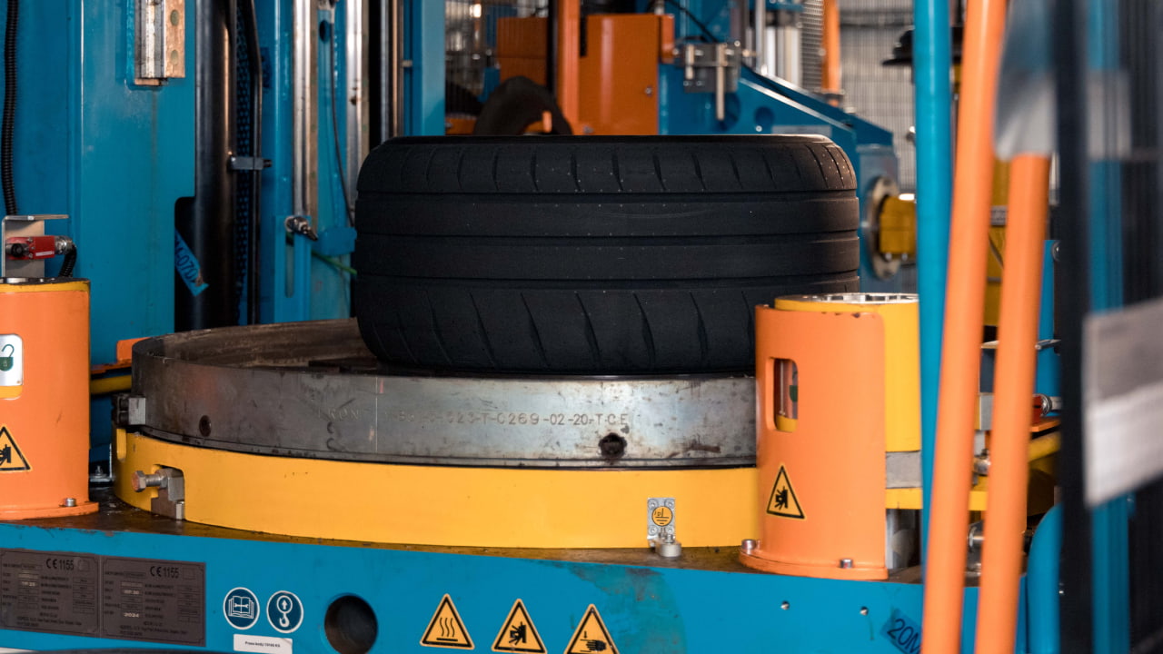 During vulcanization, the tire is placed in a mold; when the vulcanization process is complete, the tread of the tire is visible. (Photo credit: Bridgestone)