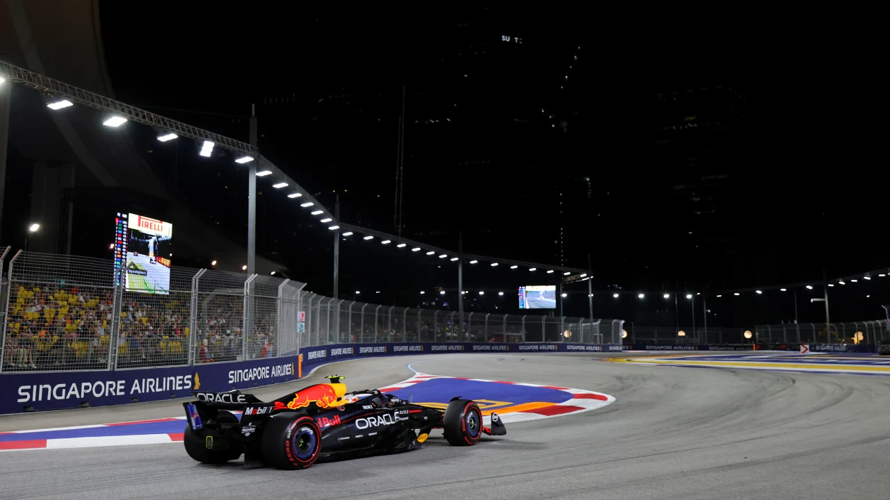 Yuki Tsunoda’s Red Bull during the 2025 Singapore Grand Prix. Track lighting is set up all around the length of the circuit to make it easy for drivers and audiences to see. (Photo: Bryn Lennon, Getty Images/Red Bull Content Pool)