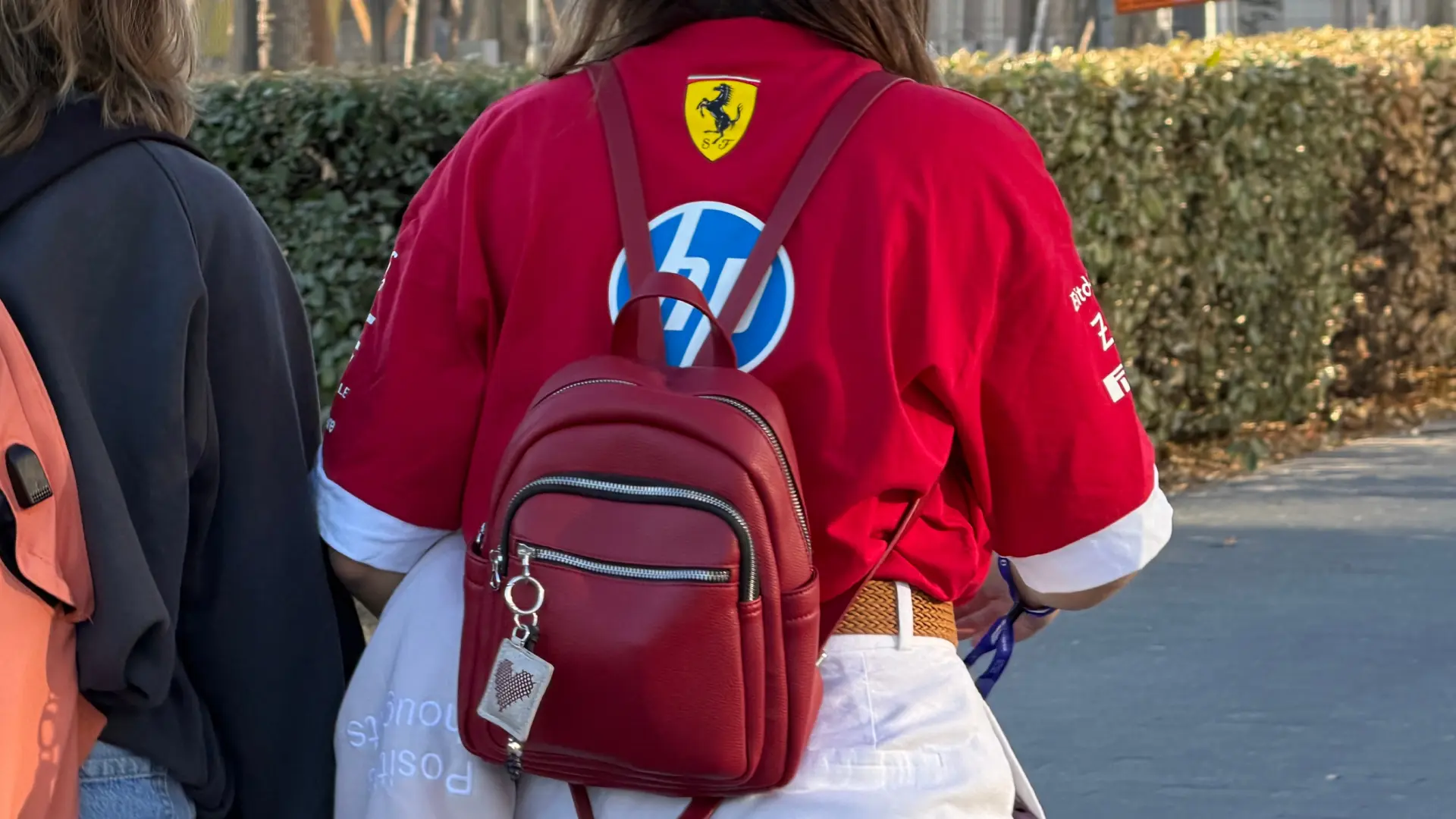 An F1 fan walking with a small backpack. (Photo: Ric Pacheco/FanAmp)