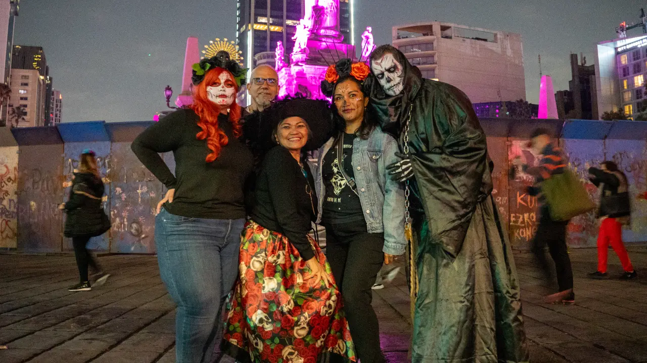 People celebrating during a Day of the Dead Parade in Mexico City (Photo: Greg Kallman/FanAmp)