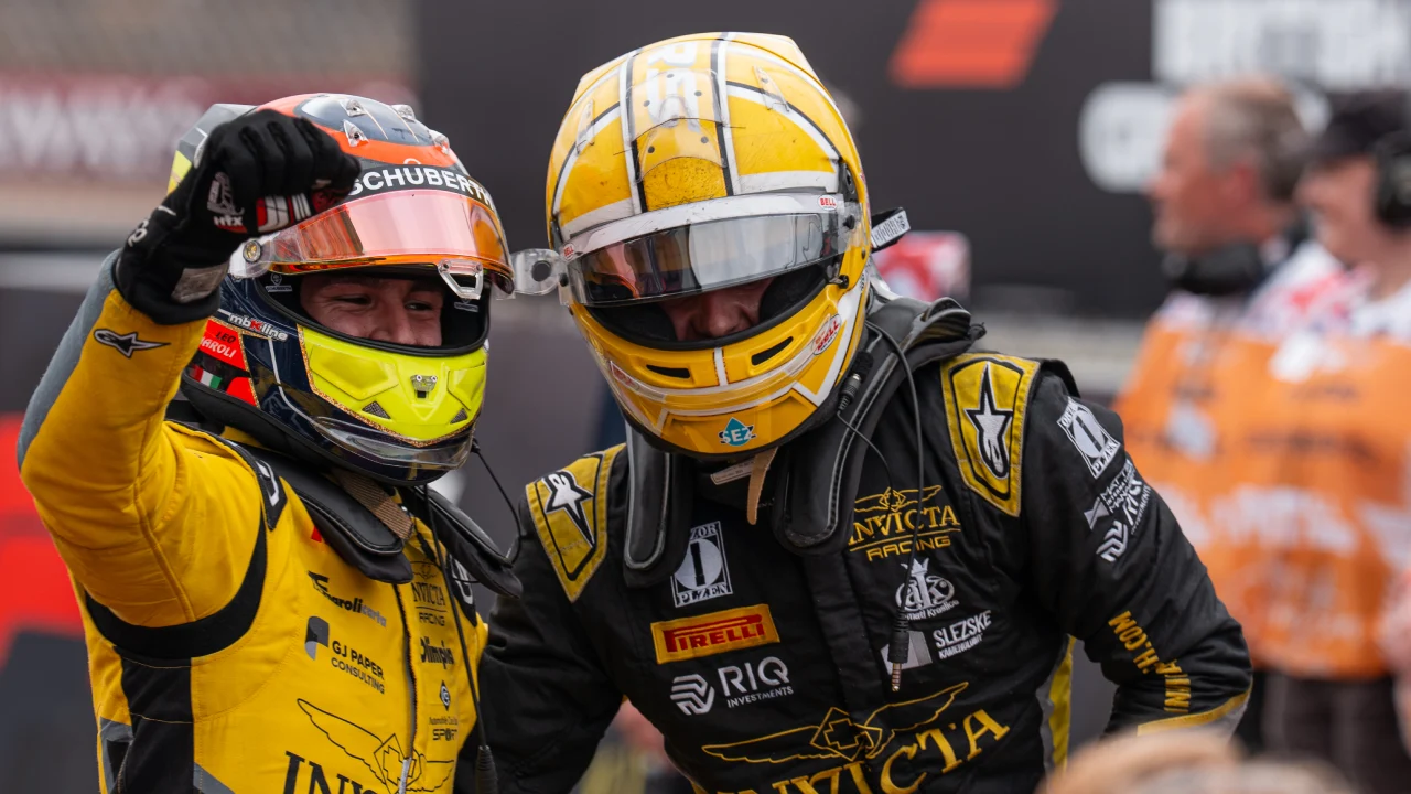 Invicta teammates Leonardo Fornaroli (left) and Roman Stanek (right) celebrate their podium finishes for the sprint of the eighth F2 2025 Championship round in Silverstone, UK. (Photo: Greg Kallman/FanAmp)
