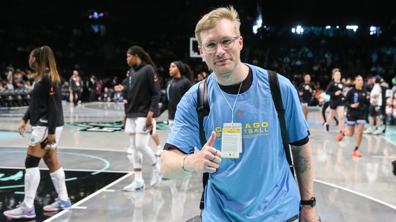 Jordan Bank poses for a picture at a women's basketball game. (Photo courtesy of Jordan Bank)