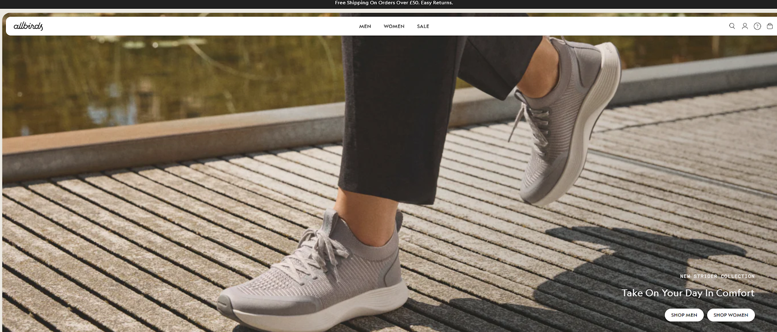 A person's feet in grey shoesAI-generated content may be incorrect.