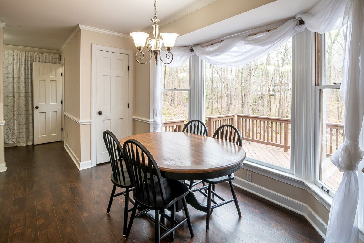 Bright dining room filled with natural light from large new windows