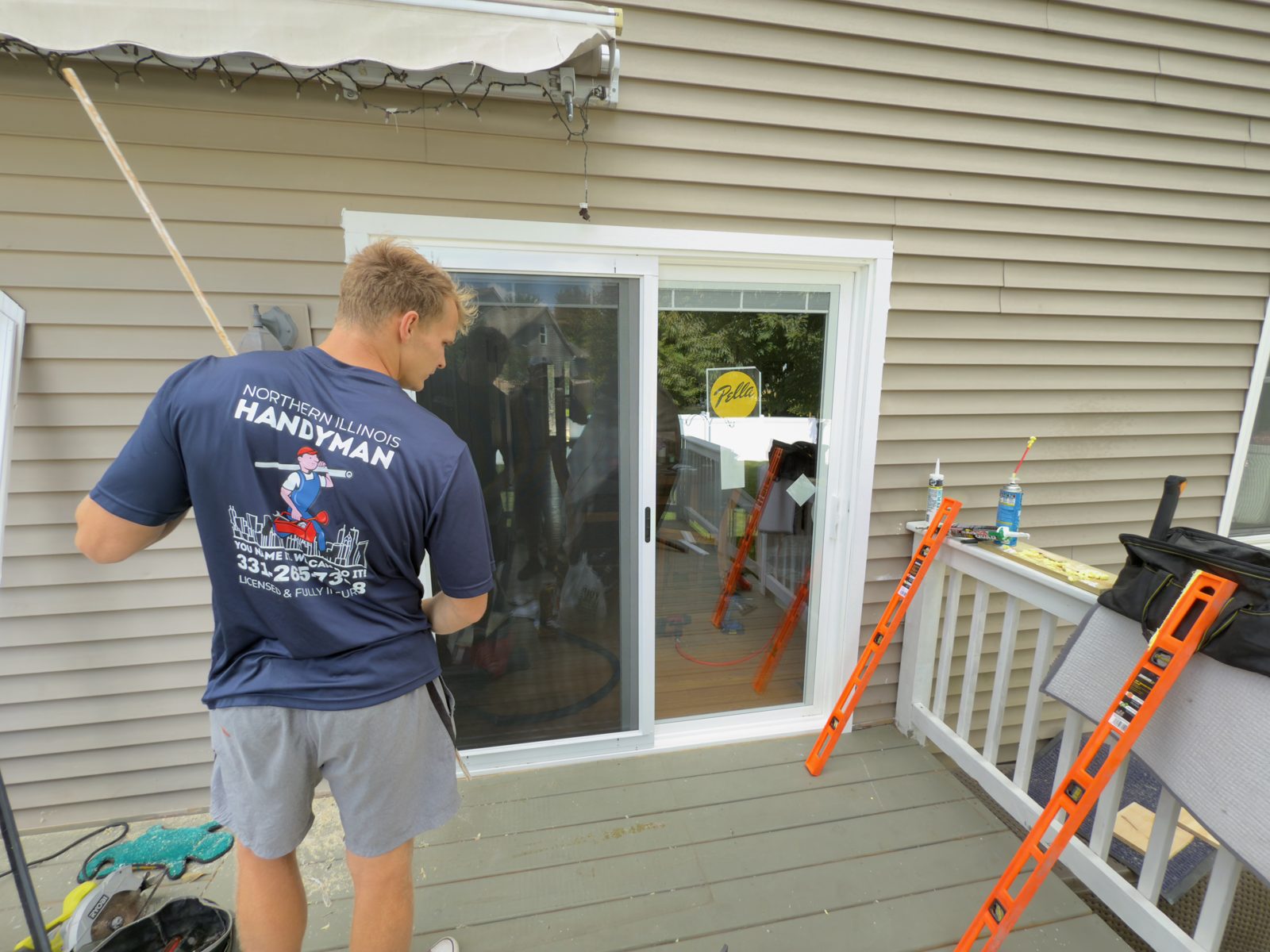 Crew member installing a Pella sliding door