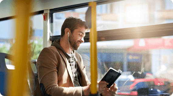 Passenger boarding an intercity bus booked through redBus