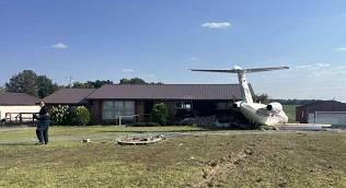 AIR PLANE HITS HOME
