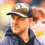 UK HIRES NEW FOOTBALL COACH