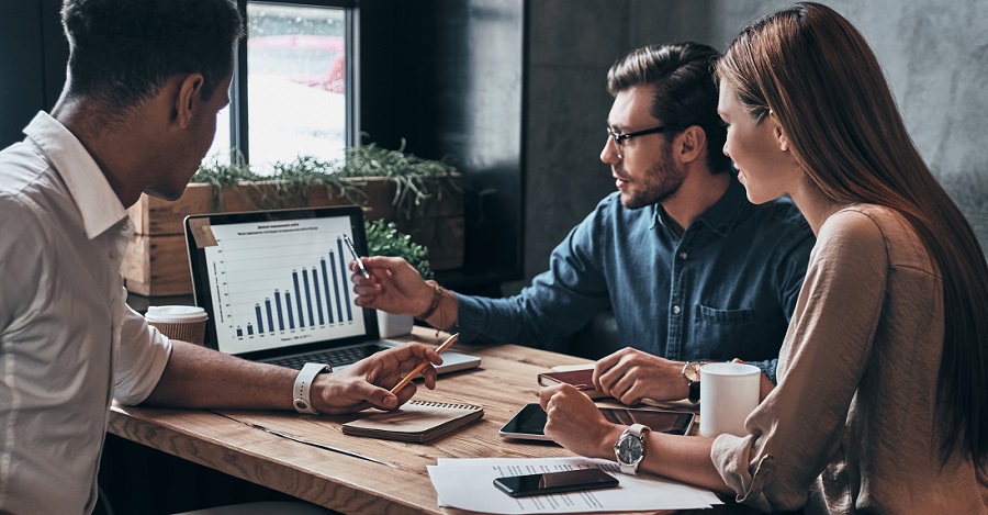 Business people looking at a chart on a computer