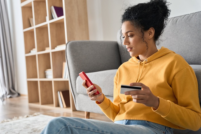 Woman using a credit card for online shopping