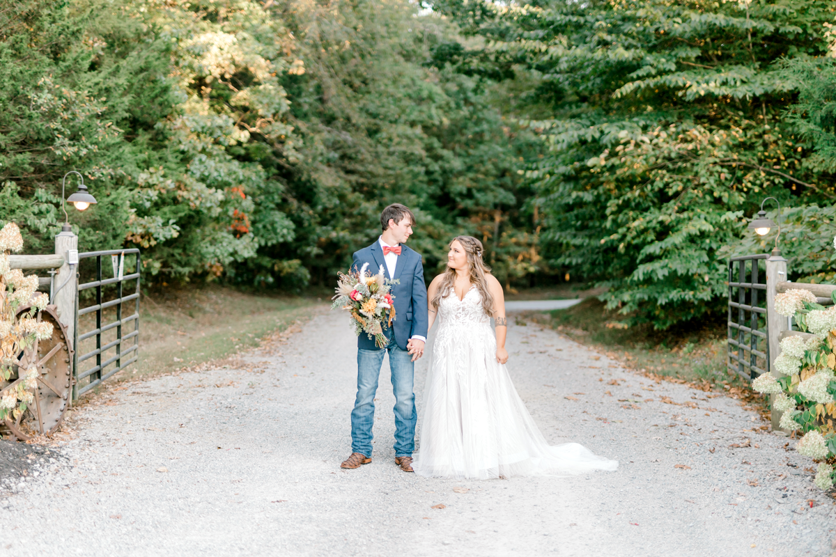 Couple portrait in middle of the gravel road.  Secluded destination wedding venue in south central Kentucky. 