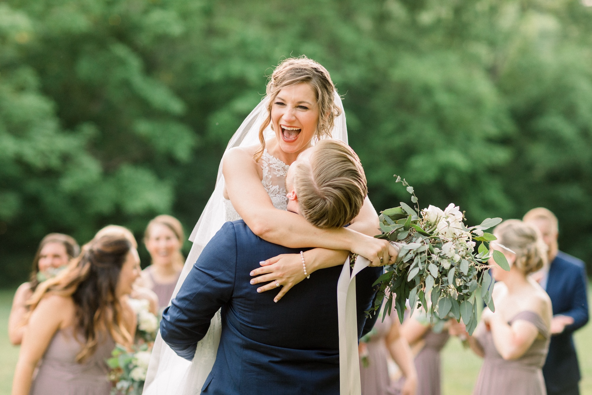 A happy moment as groom picks up his new bride at The Barn at Cedar Grove 