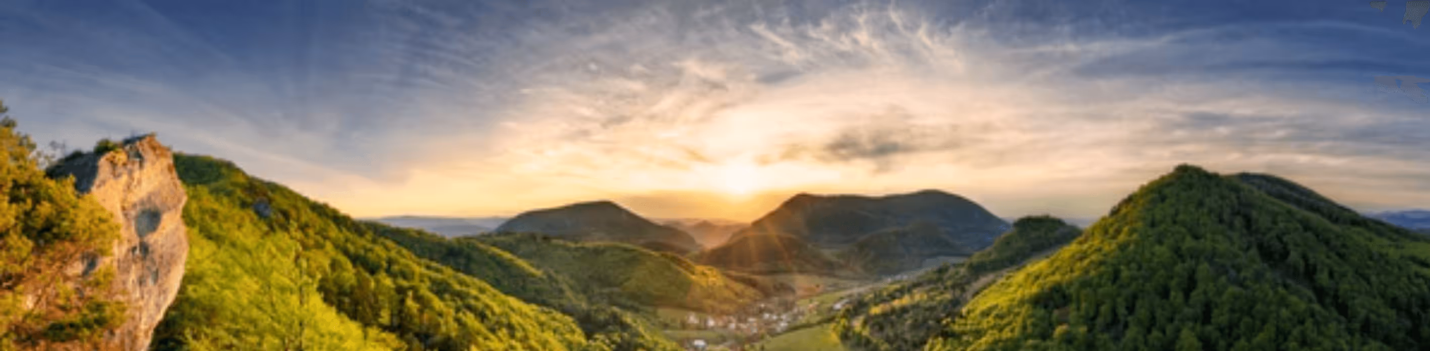 Beautiful Sunrise over mountains and a town in the valley