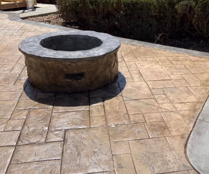 Decorative Stamped Concrete Patio with Custom designed Concrete Fire Pit