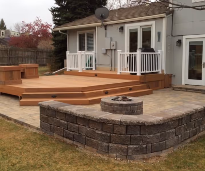 Custom Concrete Patio with Matching Stone Fire Place and Seating bench