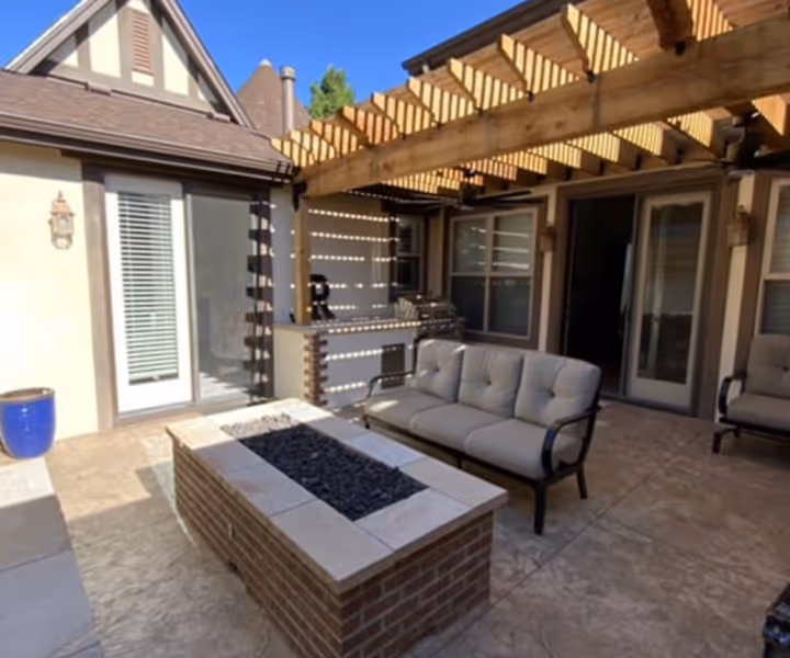 Concrete Patio with a customer Firepit and Pergola