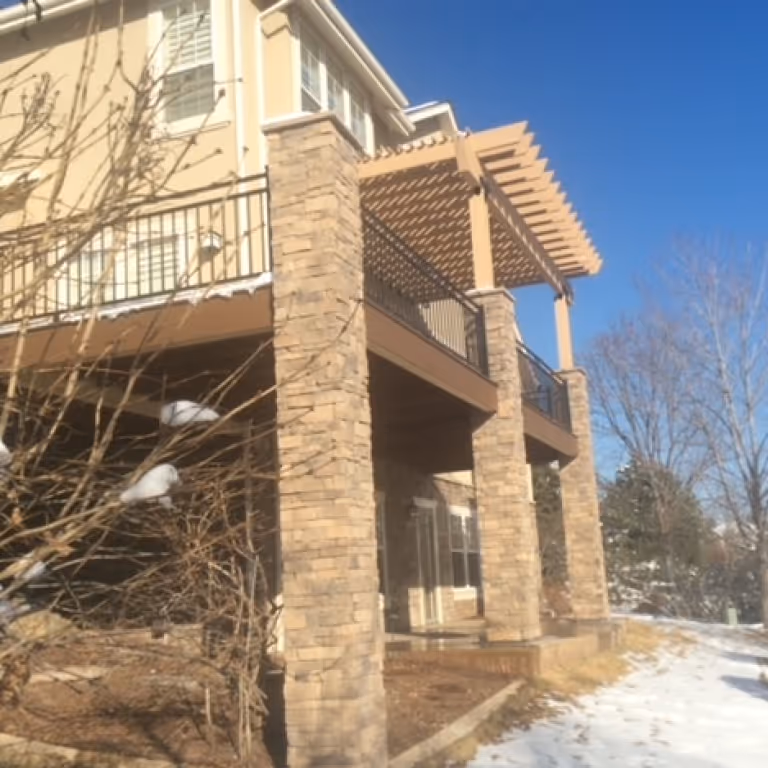 Pergola over a deck and stone columns