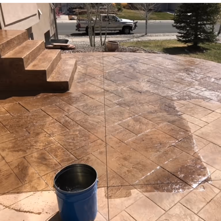 Stunning Auburn Decorative Stamped Concrete Patio Getting Sealer applied