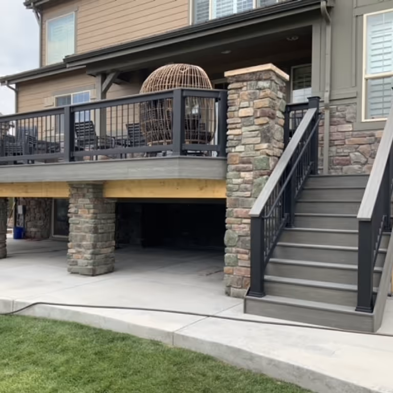 Garden Level Deck with stairs and stone columns