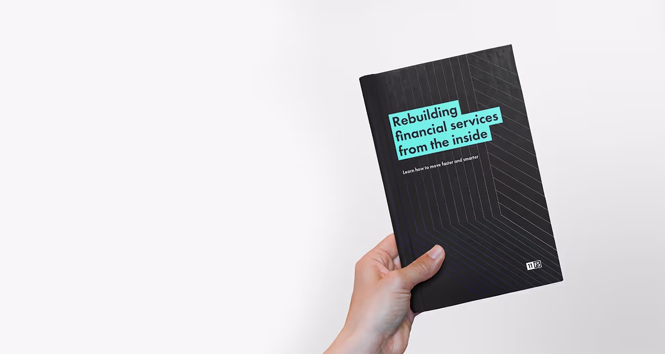 Person holding the Rebuilding financial services from the inside report
