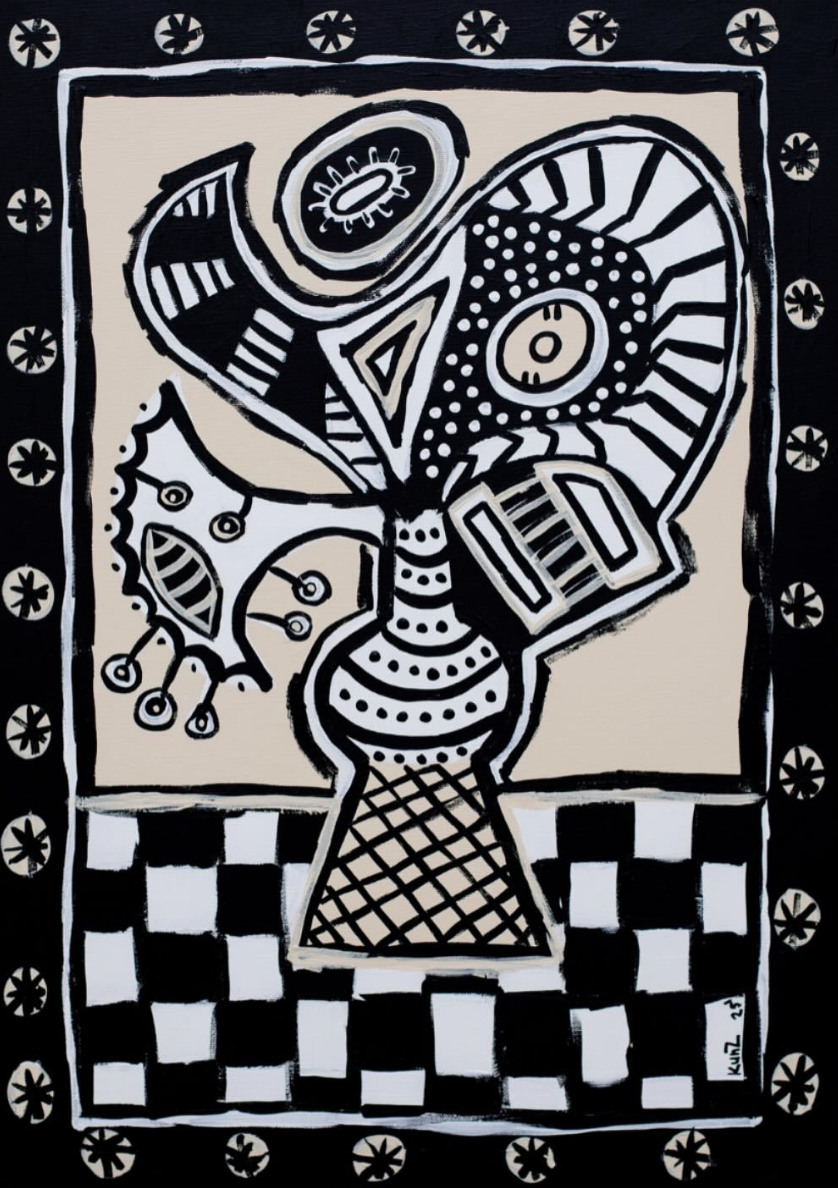 Flowers in a vase on a checkered tablecloth