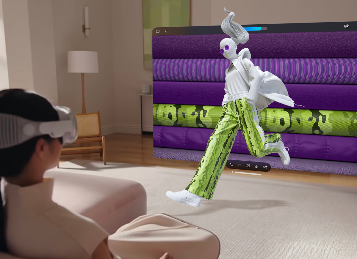Someone wearing Apple Vision Pro on a sofa, designing a 3D outfit that floats in the room among rows of fabric rolls.