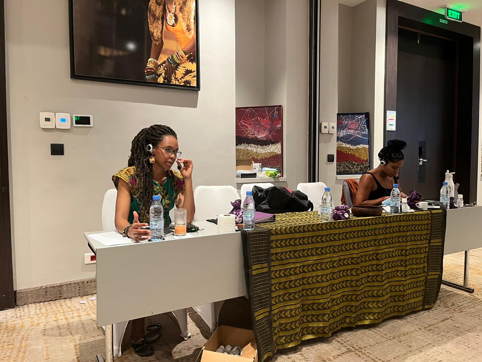 Ane and Roze interpreting at a convening in Senegal