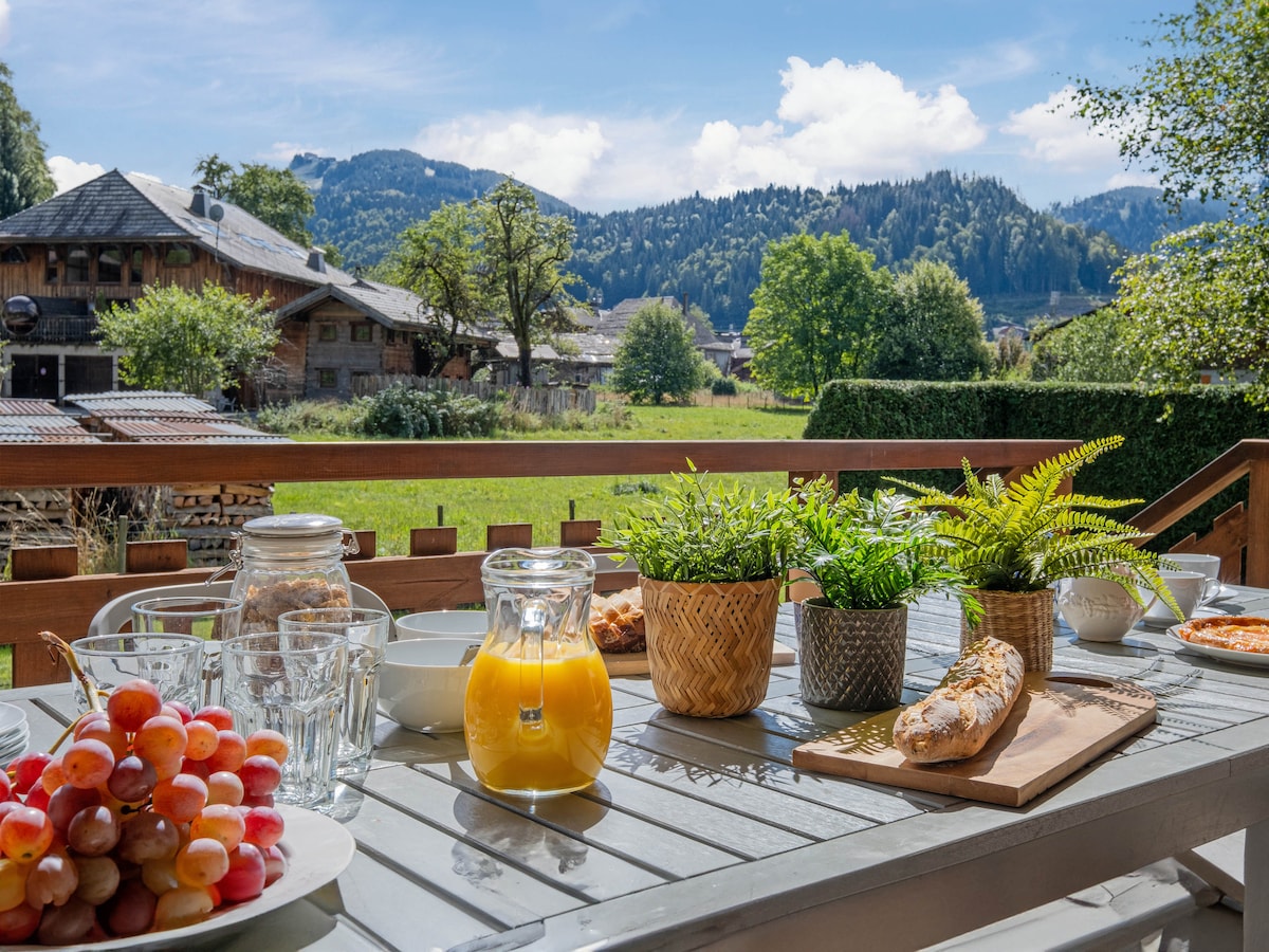 Balcony breakfast table with mountain views at Chalet Bolay, Montriond near Morzine