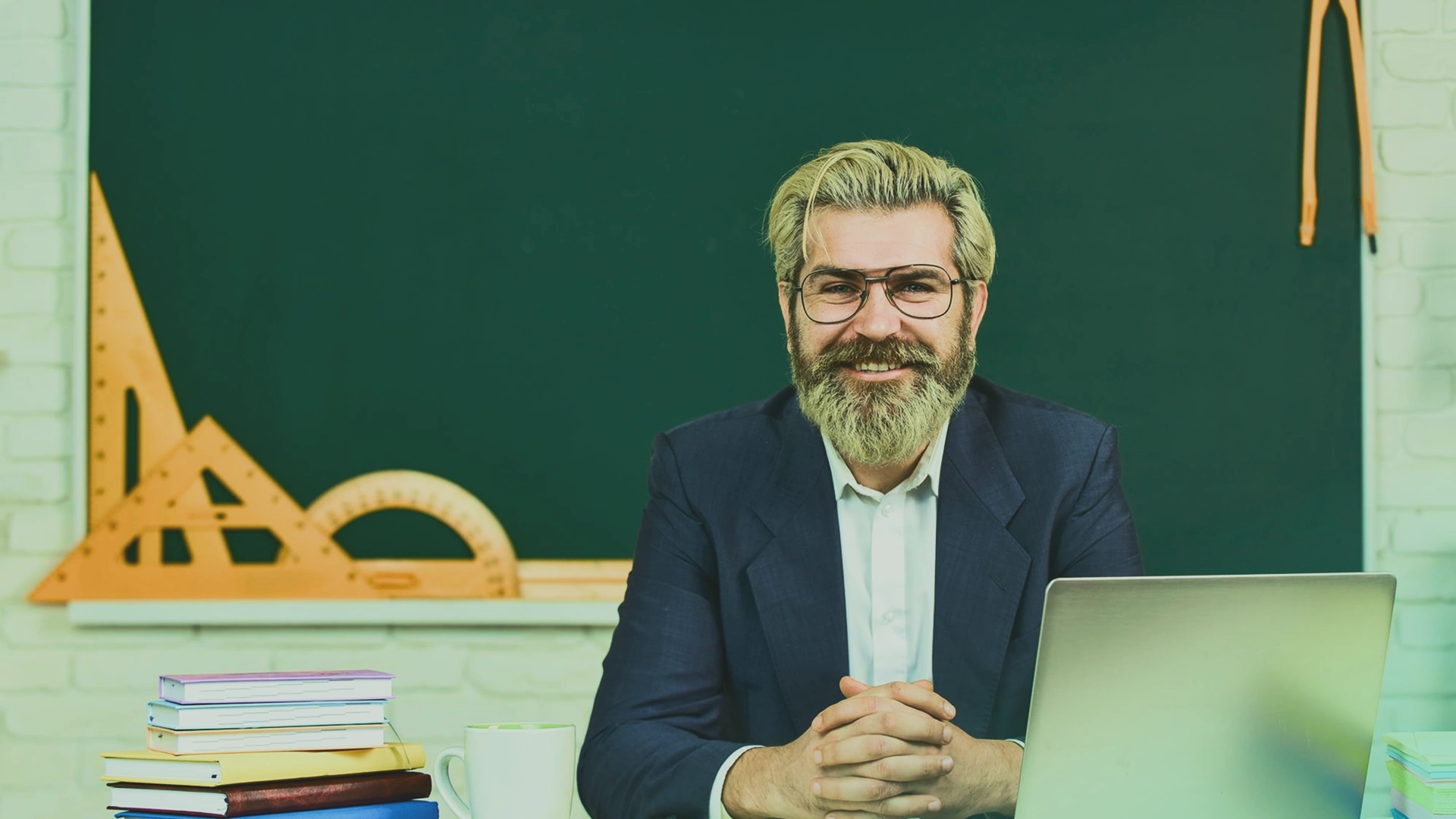 Teacher using a laptop Image 