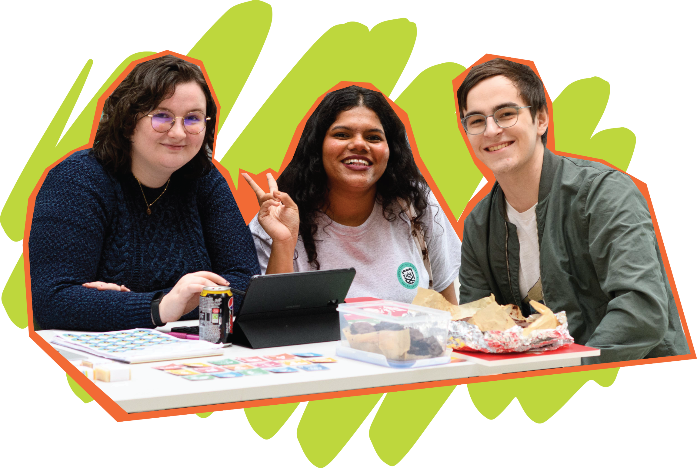 Three students smiling while looking at the photographer