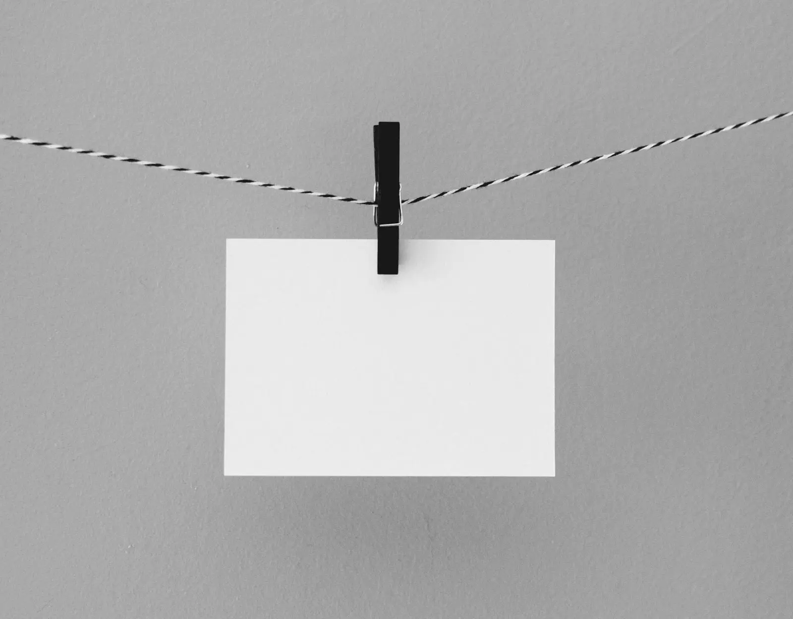 A blank piece of paper pegged to a string