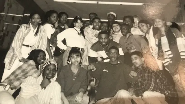 An old black and white photograph of a group of young african-americans