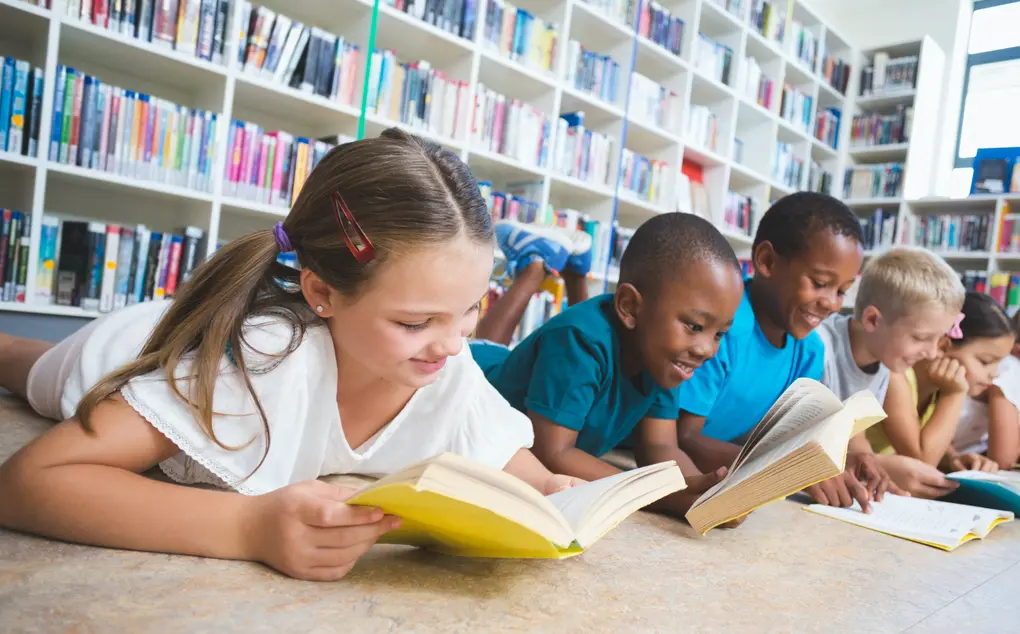 Students Reading A Book - New Leaders - Education Leadership Development