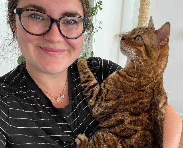 Maple the cat in moms arms.