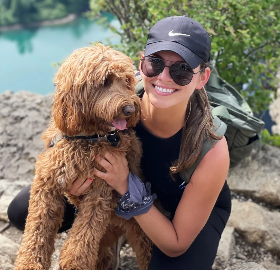Mulligan the dog posing with mom.