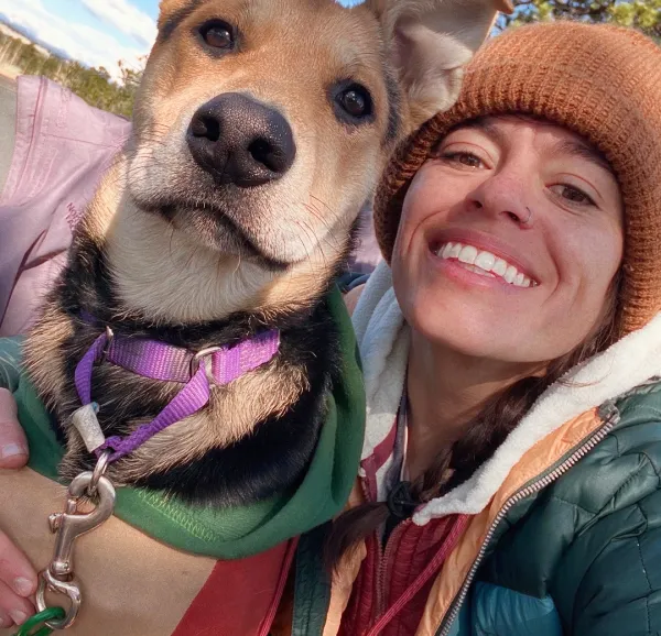 Fetch employee Emmaline I. with her dog.