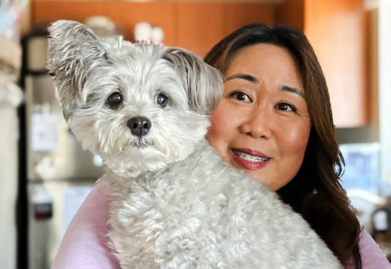 Coco Pop the dog with their mom.