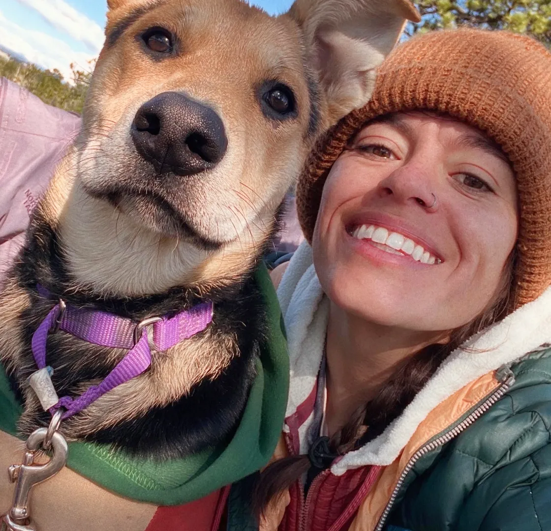 Fetch employee Emmaline I. with her dog.
