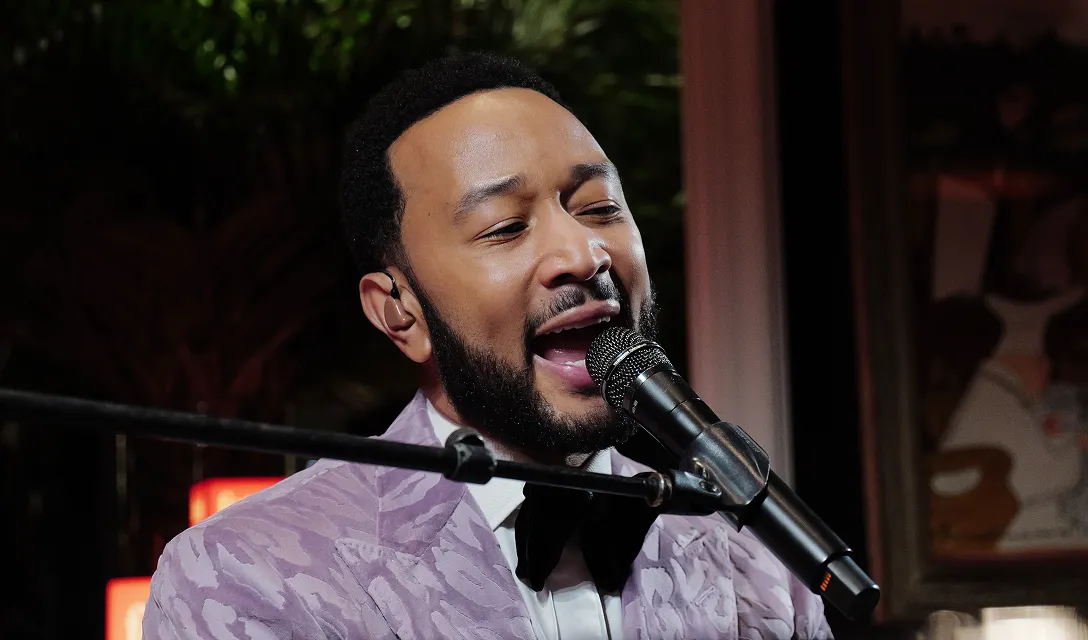 John Legend pictured singing at the Fetch Pet Gala.