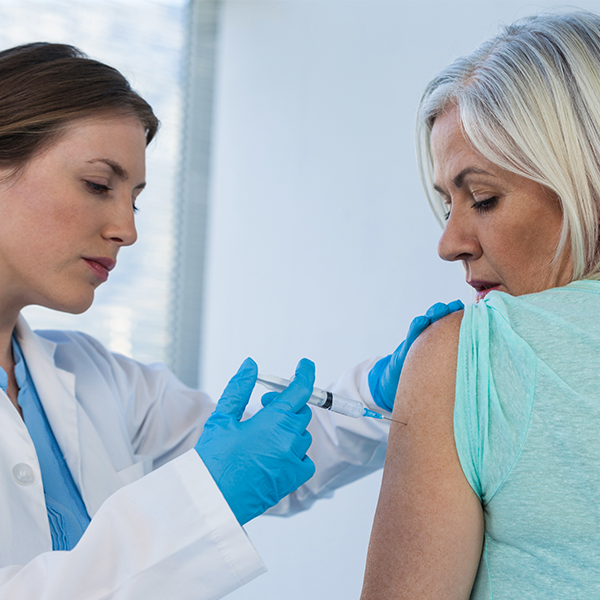 doctor administering allergy shots to a patient