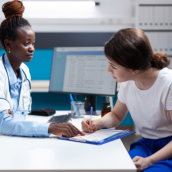 doctor and patient looking at medical bills indicating allergy shots price