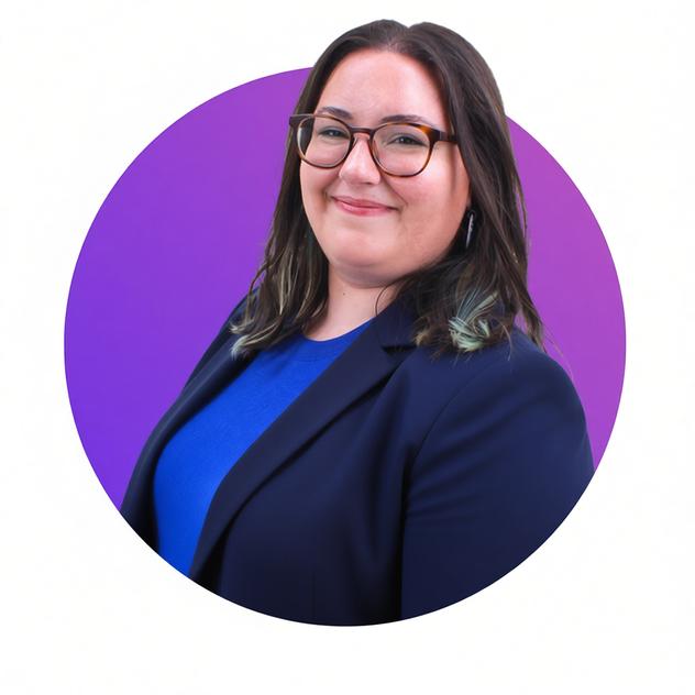 A professional photo of Olivia in front of a white background and pink/purple gradient spot that Olivia is poking out of. She is smiling and the photo gives off a happy vibe.