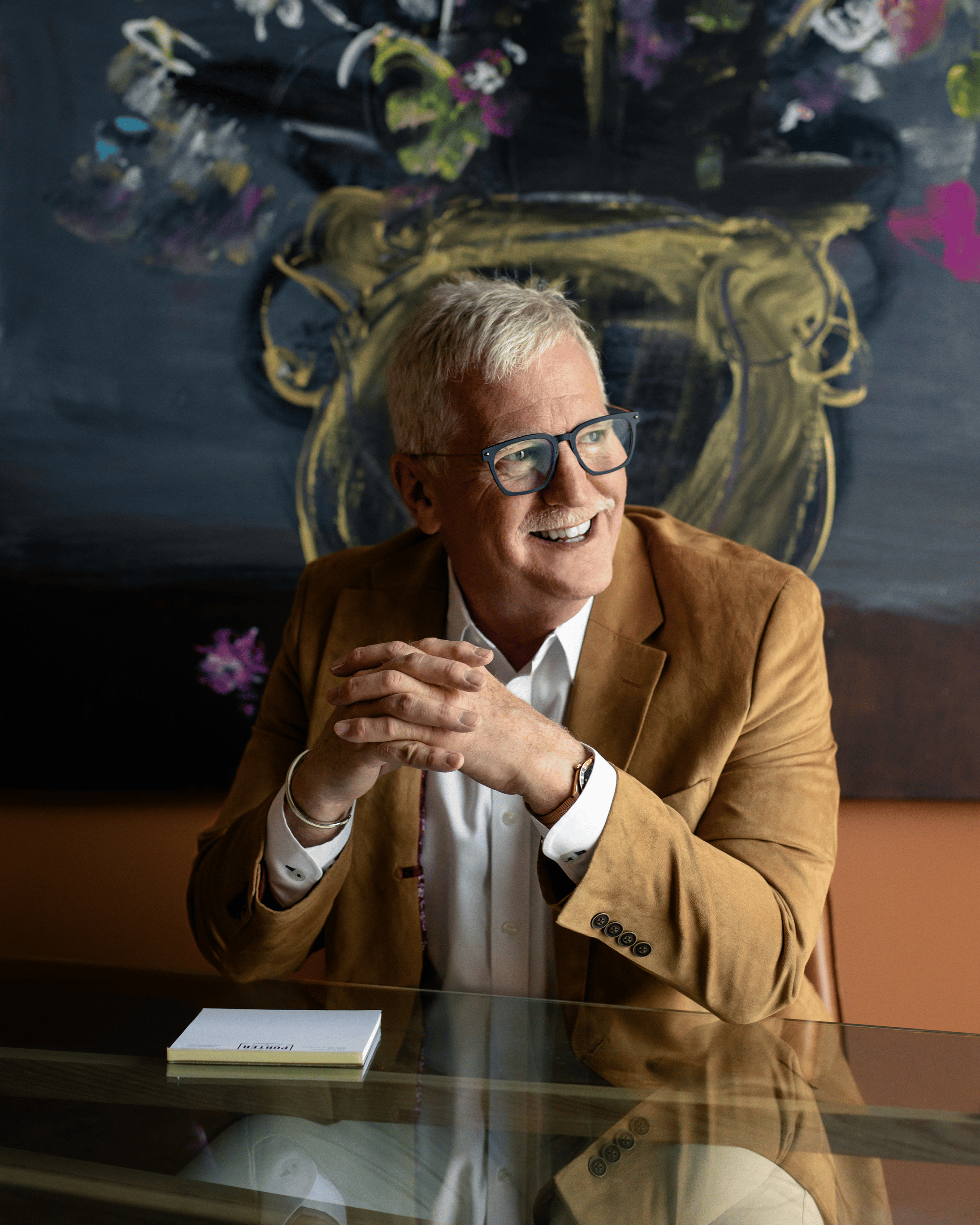Portrait of Randel Porter seated at his desk in his office