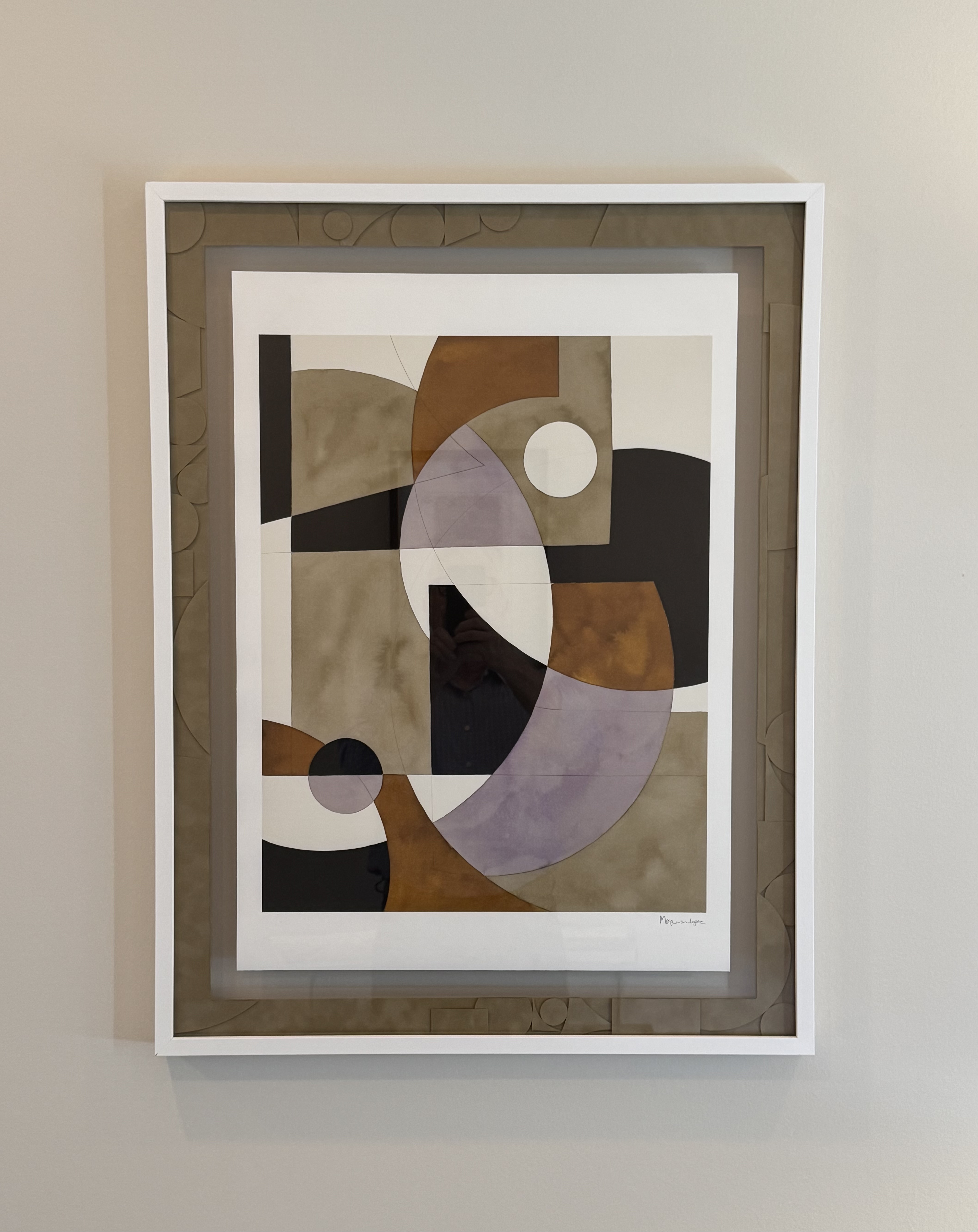 Abstract geometric artwork with overlapping shapes in muted brown, black, lavender, and beige tones, framed with a white border.
