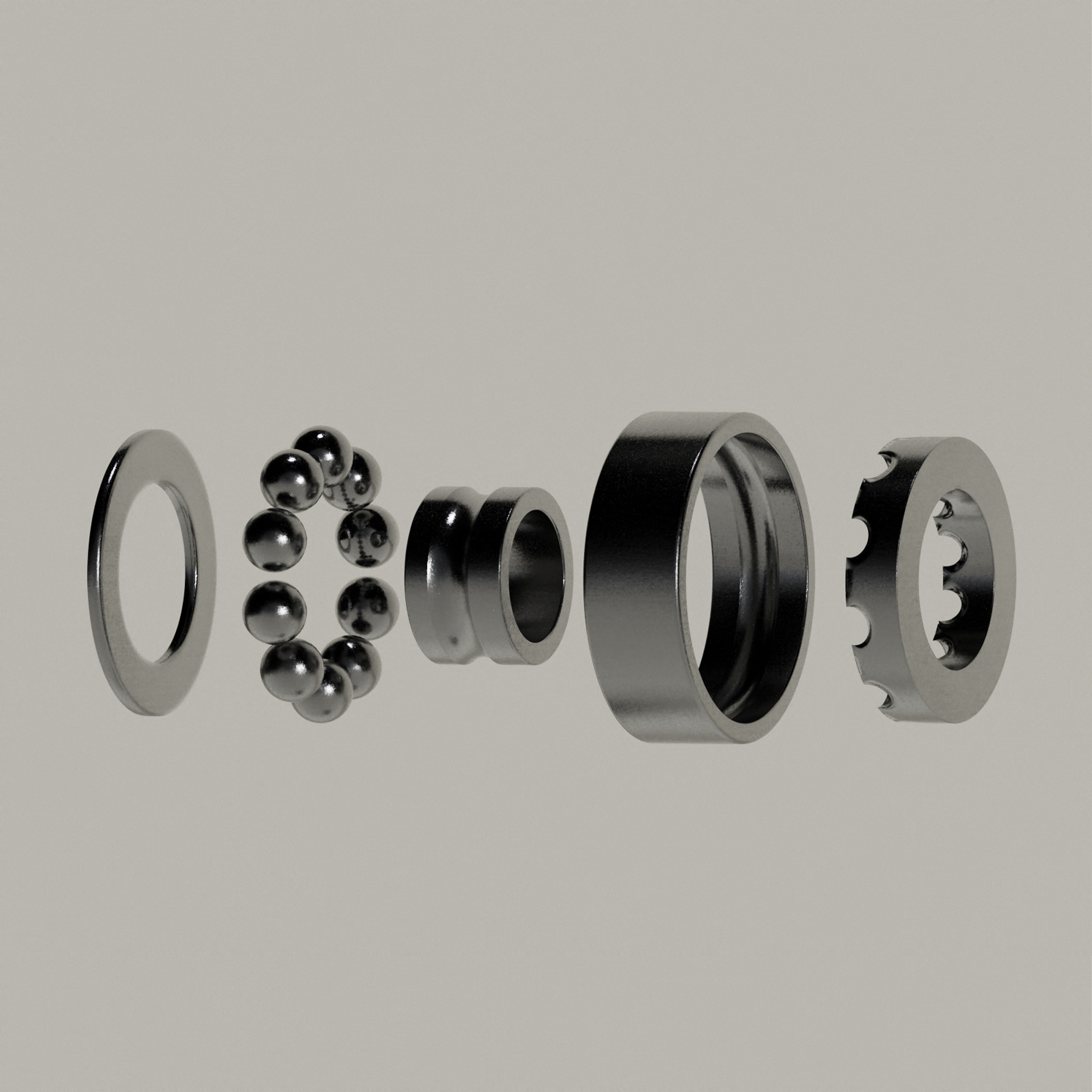 Exploded view of a metal ball bearing showing its rings and spherical balls on a neutral background.
