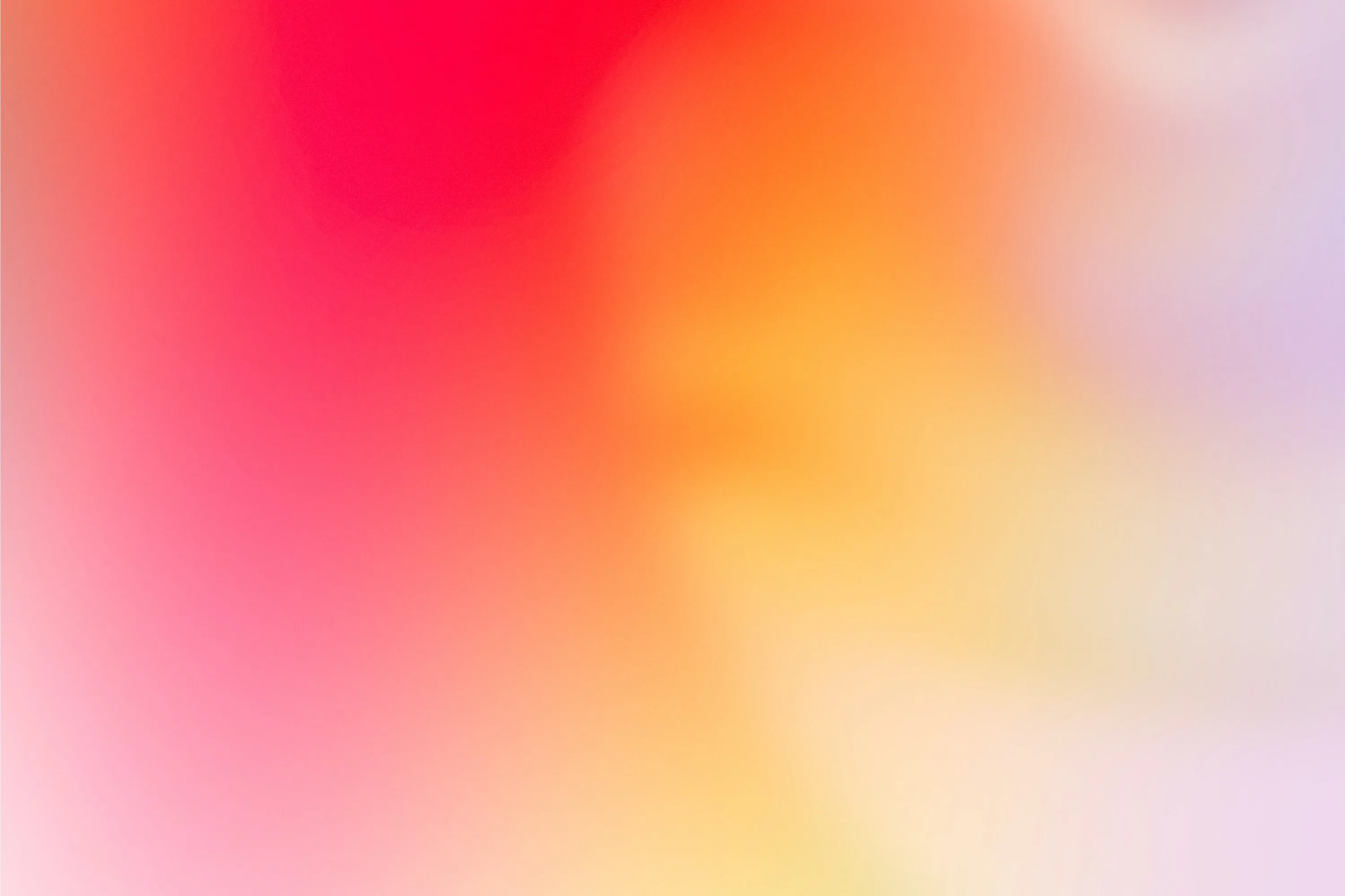 Soft gradient background blending red, pink, orange, and light purple hues.
