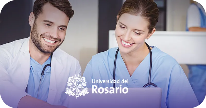 Two smiling healthcare professionals, a man and a woman, looking at a laptop with a Universidad del Rosario logo overlay.