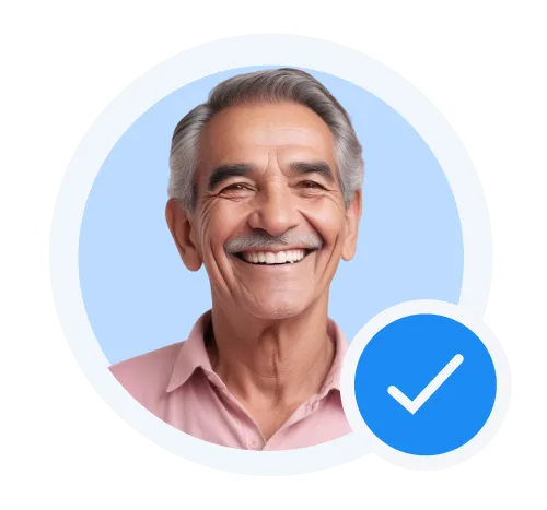 Smiling older man with gray hair and mustache wearing a pink shirt, with a blue verified badge in the corner.