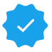 Blue badge icon with a white checkmark in the center.