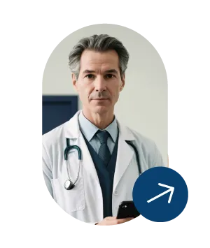 Middle-aged male doctor with gray hair wearing a white coat and stethoscope, holding a smartphone.
